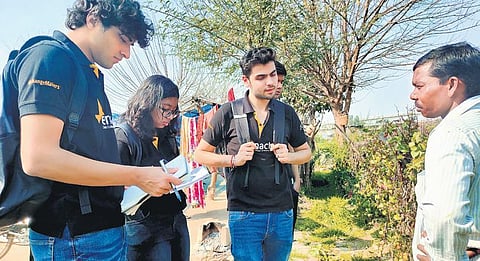 Members of the Zaraat team interacting with the farmers