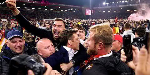 Bournemouth manager Scott Parker (C) is surrounded as they celebrate winning promotion to the Premier League after defeating Nottingham Forest in a Sky Bet Championshipmatch. (Photo| AP)