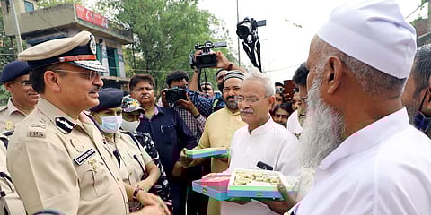 Special Commissioner of Police Deependra Pathak interacts with citizens on the occasion of Eid al-Fitr, at Jahangirpuri in New Delhi. (Photo| ANI)