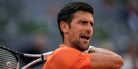 Serbia's Novak Djokovic returns the ball against France's Gael Monfils during the Madrid Open tournament in Madrid. (Photo| AP)