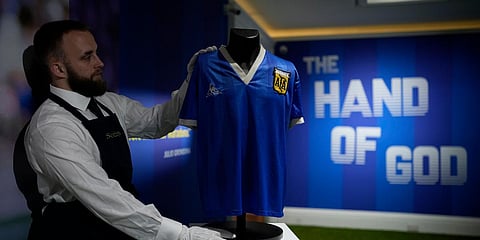 Diego Maradona's Argentina football shirt worn during the 1986 Mexico World Cup quarterfinal match against England, is displayed at Sotheby's auction house, in London. (File photo| AP)