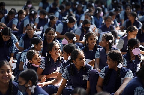 Students waiting outside the examination halls of Government Girls Higher Secondary School at Ashok Nagar in Chennai on Thursday morning. (Photo | R Satish Babu, EPS)