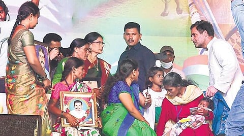 Rahul Gandhi consoled the families of farmers who died by suicide before he began addressing the public meeting at the University Arts and Science College in Warangal. (Photo | ESP)