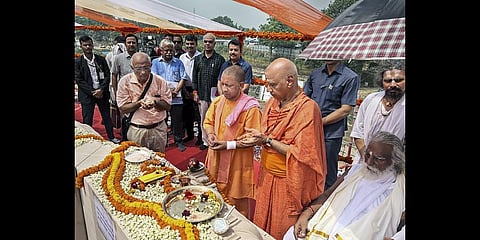 Uttar Pradesh Chief Minister Yogi Adityanath lays the foundation stone of the sanctum sanctorum of the Ram temple, in Ayodhya. (PTI Photo)