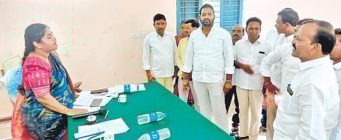 Sarpanches in Toopran mandal in Gajwel constituency argue with the MPDO before boycotting a Palle Pragathi preparatory meeting. (Photo| EPS)