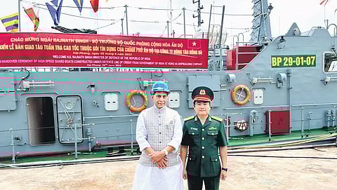 Defence Minister Rajnath Singh with a security force personnel of Vietnam, during a ceremony to hand over 12 High Speed Guard Boats. (Photo | PTI)