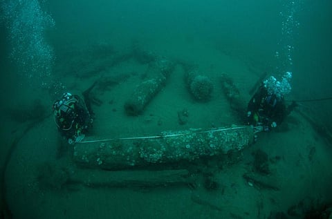 Julian And Lincoln Barnwell measure the cannon found on the HMS Gloucester in 2007. (File Photo | AP)