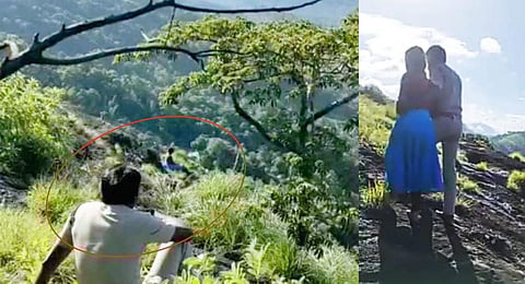 Sub-inspector K M Santosh trying to dissuade the tribal girl from jumping off the edge of a hill in Kuthiralam Kudi near Adimali.