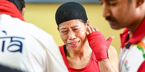 Indian boxer Mary Kom reacts after getting injured during her match at the Elite Women CWG Trials 2022, at Indira Gandhi Stadium in New Delhi. (Photo | PTI)