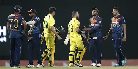 Sri Lanka's team members congratulate Australia's Matthew Wade and Jhye Richardson for their victory in the second Twenty20 cricket match Wednesday, June 8, 2022. (AP Photo)