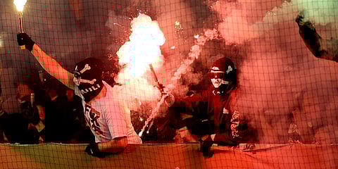 Supporters of St. Pauli light fireworks during a German Cup match. (File Photo | AP)