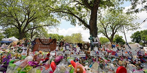 Pecan trees shade a memorial created to honour the victims killed in the recent school shooting at Robb Elementary on Thursday, June 9, 2022, in Uvalde, Texas. (Photo | AP)