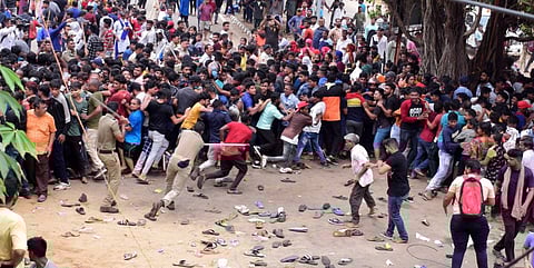 Police resort to baton charging the crowd outside Barabati Stadium.