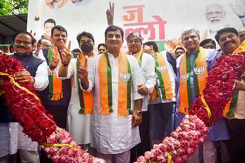 Union Minister Jyotiraditya Scindia and Ashwini Vaishnaw, former Maharashtra CM Devendra Fadnavis, state BJP President Chandrakant Patil and others flash the victory sigh. (Photo | PTI)