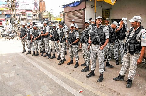 Security personnel stand alert, a day after clashes during protest against now-suspended BJP leaders' remarks on Prophet Muhammad. (Photo | PTI)