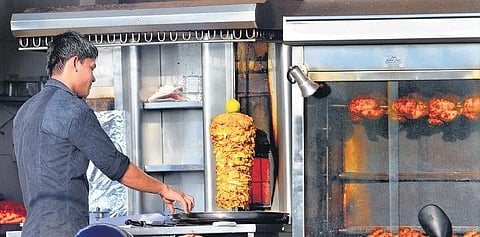 A cook preparing Shawarma at one of the bakeries in Kochi. (Photo | A Sanesh)