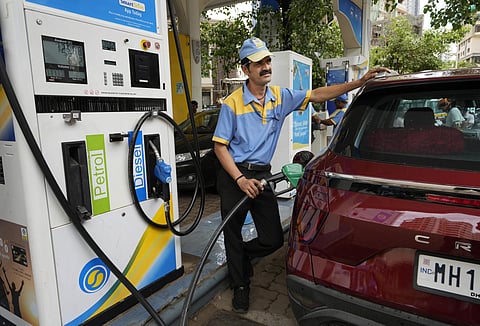 An employee of a Bharat petroleum fuel station fills petrol in a vehicle in Mumbai, India, Saturday, June 11, 2022. (Photo | AP)