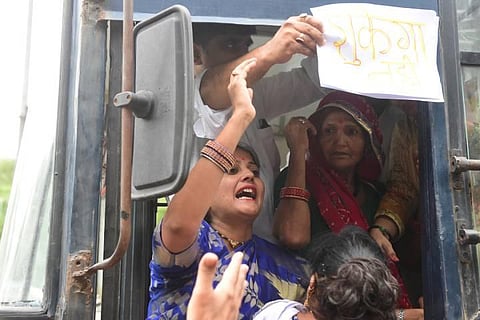Congress activists being detained during a protest against summoning of the party's president Sonia Gandhi and party leader Rahul Gandhi in the National Herald case. (Photo | PTI)
