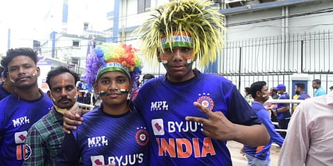 Cricket fans get their cheeks painted with the tricolour before the start of the India-South Africa T20I at Barabati Stadium in Cuttack. (Photo| EPS)