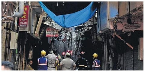 Firefighters at a shoe market in Karol Bagh on Sunday (Photo | Shekhar Yadav)