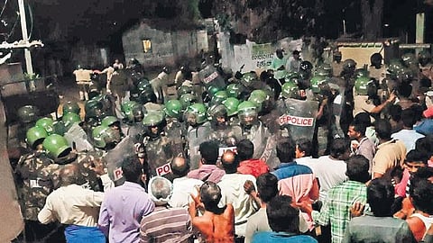 A large number of police personnel enter Gudatipalli village in the early hours of Monday