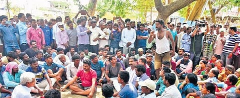 District Additional Collector Srinivas Reddy interacts with the Gudatipally oustees at the Husnabad RDO office in Siddipet district, on Monday