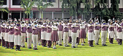 Students take a pledge during assembly at DAV Public School, Safilguda on Monday