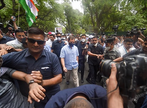 Congress leader Rahul Gandhi leaves for ED office amid protests by party workers, after being summoned for questioning in the National Herald case. (Photo | PTI)