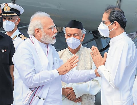 PM Narendra Modi being received by Maharashtra CM Uddhav Thackeray, in Mumbai on Tuesday. Governor Bhagat Singh Koshyari is also seen | PTI