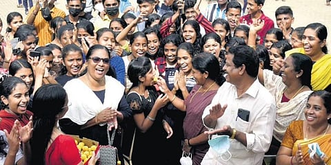 Teachers of SNDP Higher Secondary School, Udayamperoor, distributing sweets among students after the SSLC results were announced on Wednesday | A Sanesh