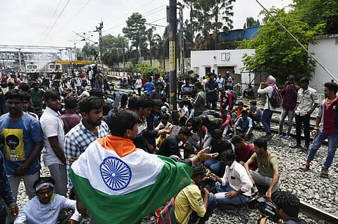 Protest against the Central government’s Agnipath Scheme turns violent as protestors set train bogies on fire at Secunderabad Railway Station. (Photo | Vinay Madapu/EPS)