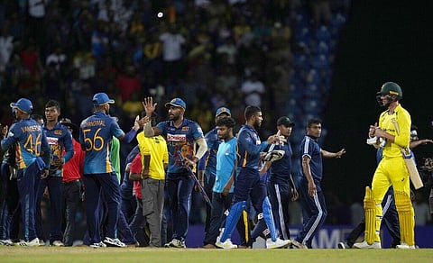 Sri Lankan team members celebrate after defeating Australia by 26 runs in the second one-day international cricket match in Pallekele. (Photo | AP)