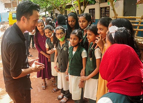 Assam native Sumit Kujur interacts with students on June 16 at Kalpathur AUP School, Perambra, Kozhikode district, Kerala. (Photo | E Gokul, EPS)