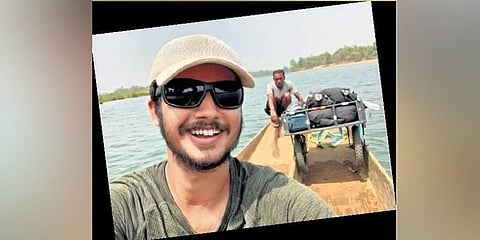 Asutosh Joshi takes a selfie while crossing the Indravati river in Chhattisgarh