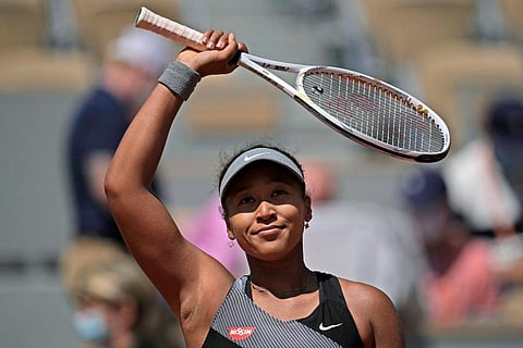 Japan's Naomi Osaka celebrates after defeating Romania's Patricia Maria Tig during a first-round match of the French Open tennis tournament at Roland Garros stadium in Paris. (Photo | AP)
