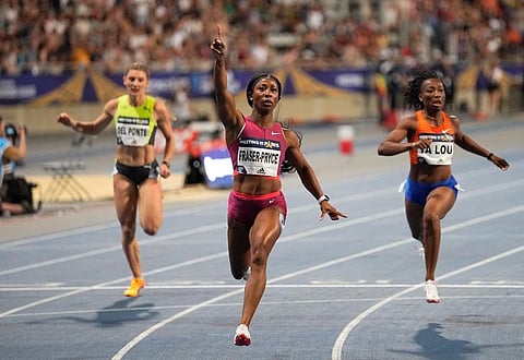 Shelly-Ann Fraser-Pryce of Jamaica raises her arm after she cross the finish line of the 100 meters women during the Diamond League athletics meeting. (Photo | AP)