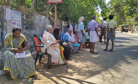 Senior Citizens wait for their turns to collect social welfare pension in Thiruvananthapuram