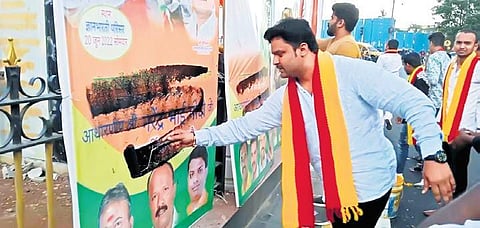 KRV acitvists blacken welcome banners in Hindi on Mysuru Road on Sunday