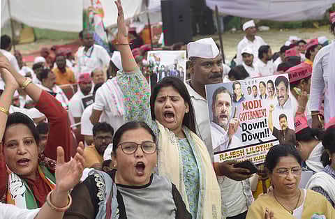 Congress workers raise slogans during the party's 'Satyagraha' against Central government's 'Agnipath' scheme and ED's probe against party leader Rahul Gandhi in the National Herald case. (PTI)