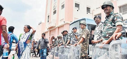 Security personnel stand guard at the Secunderabad Railway Station on Sunday following Friday’s violence