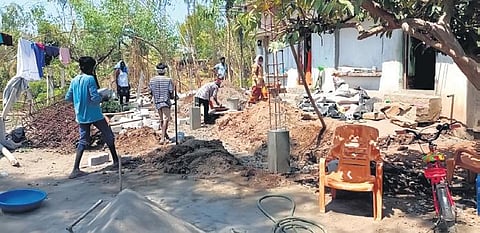 Workers engaged in the construction of a building on the land belonging to the Lord Rama temple at Bhadrachalam. (Photo | Express)