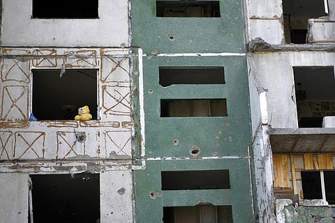 A teddy bear is seen on a building destroyed by attacks in Chernihiv, Ukraine. (Photo| AP)