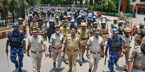 Security personnel patrol the areas near Varanasi Railway Station amid nationwide protests against the Central government's 'Agnipath' scheme, in Varanasi. (Photo | PTI)