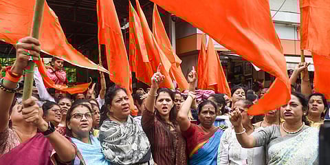 Shiv Sena supporters shouts slogan in support of CM Uddhav Thackeray, outside Shiv Sena Bhavan in Mumbai. (Photo| PTI)
