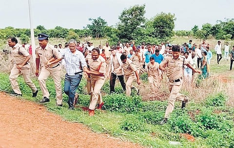 Police arrest the agitating oustees at Zaheerabad NIMZ on Wednesday