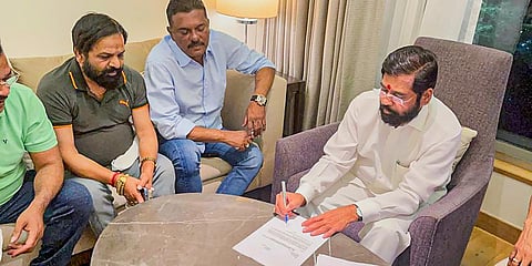 Rebel Shiv Sena leader Eknath Shinde with other MLAs during a meeting, in Guwahati. (Photo| PTI)