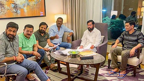 Rebel Shiv Sena leader Eknath Shinde with other MLAs at a hotel in Guwahati, Wednesday, June 22, 2022. (Photo | PTI)