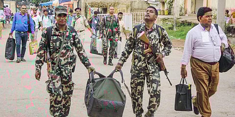 Polling officers, carrying sealed EVMs and VVPATs, arrive at Pandra Krishi Prangan after completion of Mandar Assembly constituency bypoll, in Ranchi. (Photo| PTI)