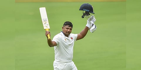Mumbai's Sarfaraz Khan acknowledges the crowd as he walks off the field after his dismissal during the second day of the Ranji trophy final cricket.(Photo | PTI)