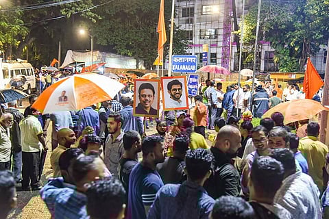 Shiv Sena workers gather outside 'Matoshree', the private residence of Maharashtra CM Uddhav Thackeray, to show their support, in Mumbai. (Photo | PTI)